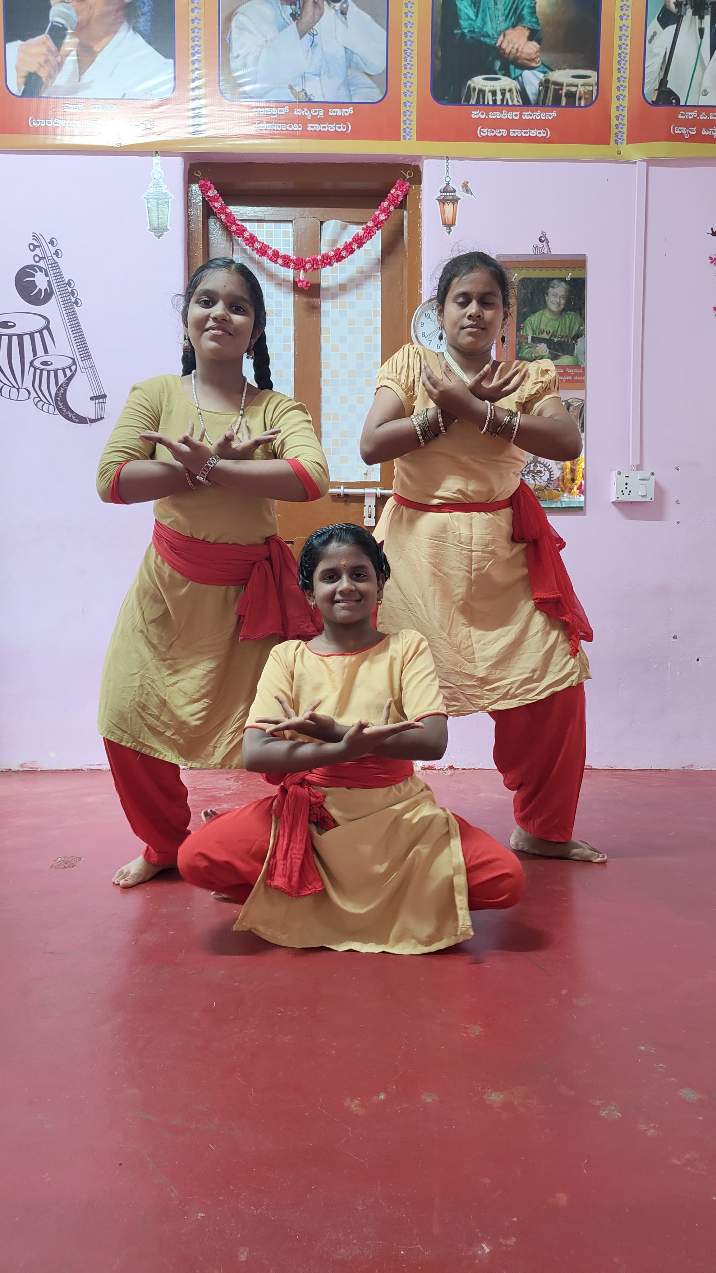 Bharatanatyam students in a classical pose