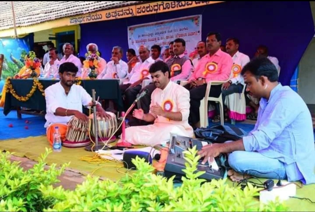 A vocal and tabla performance at an outdoor event