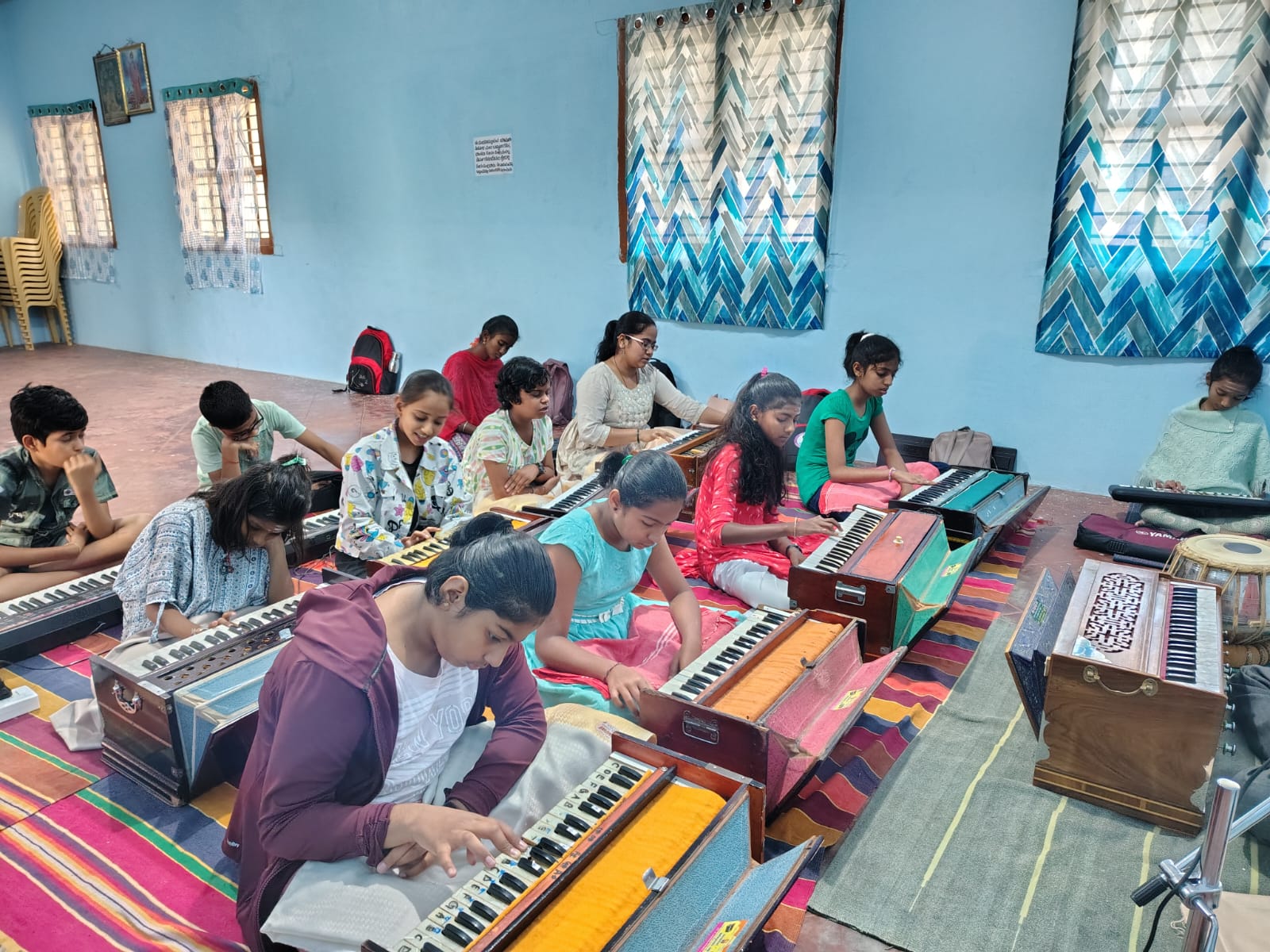 Vocal students practising on harmoniums